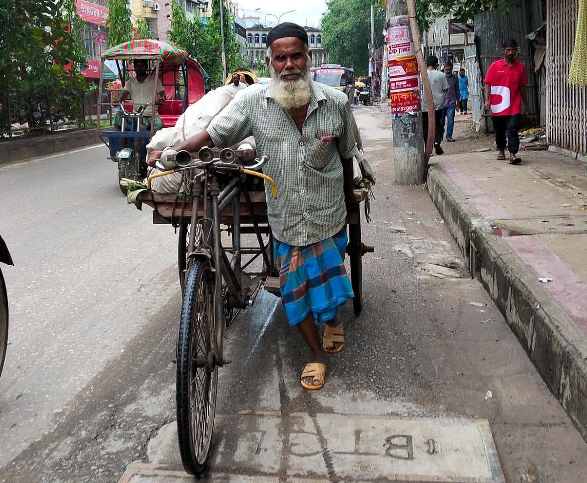 Van puller Abul Kashem transports bananas on his cycle van in Mohammadpur, Dhaka on 1 May 2026.