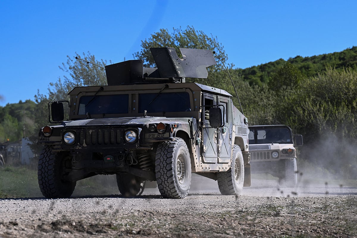 Military vehicles drive during the US Army Combined Resolve exercise at the US Army's southern Germany training facilities in Hohenfels, Germany, 30 April 2026. 