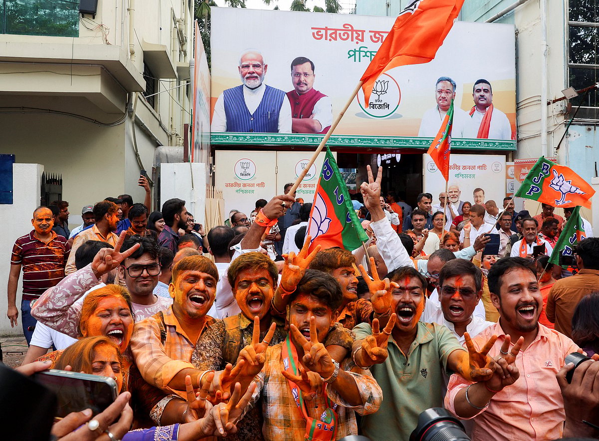 India’s ruling Bharatiya Janata Party (BJP) supporters celebrate as early trends show their party leading in the West Bengal state assembly election results, outside the party’s regional office in Kolkata, India, on 4 May 2026