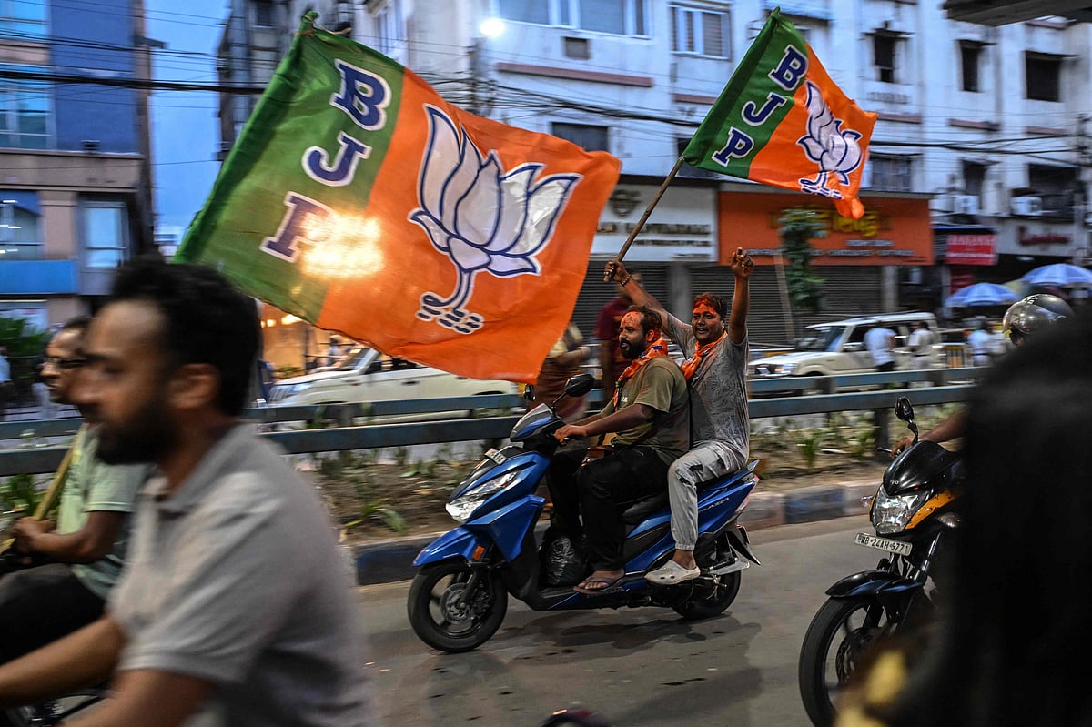 Bharatiya Janata Party (BJP) supporters celebrate after taking a lead during vote counting for the West Bengal Legislative Assembly elections in Kolkata on 4 May 2026.