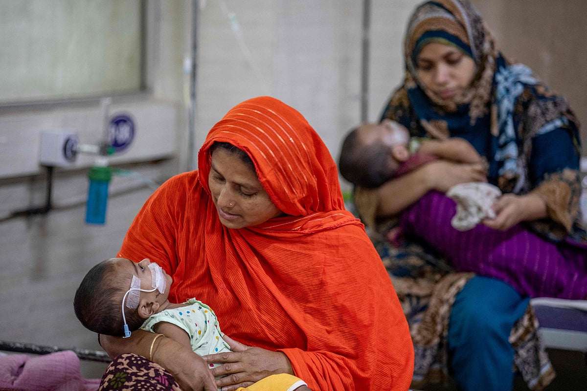 Women comfort children diagnosed with measles inside a paediatric ward at the Bangladesh Shishu Hospital and Institute in Dhaka on 6 May, 2026. Bangladesh has recorded 311 child deaths since March in one of its worst measles outbreaks in decades, government data showed on 4 May.