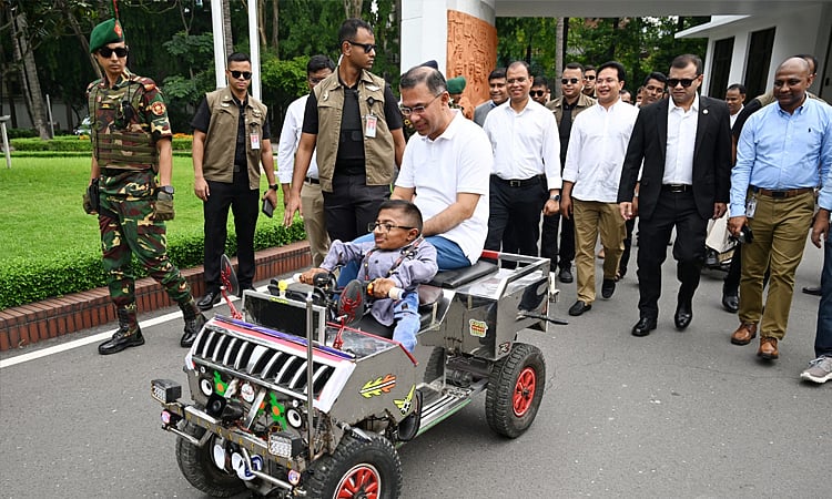 Prime Minister Tarique Rahman encourages Wakimul by riding in his smart car at the Prime Minister's Tejgaon office in Dhaka on 9 May 2026.