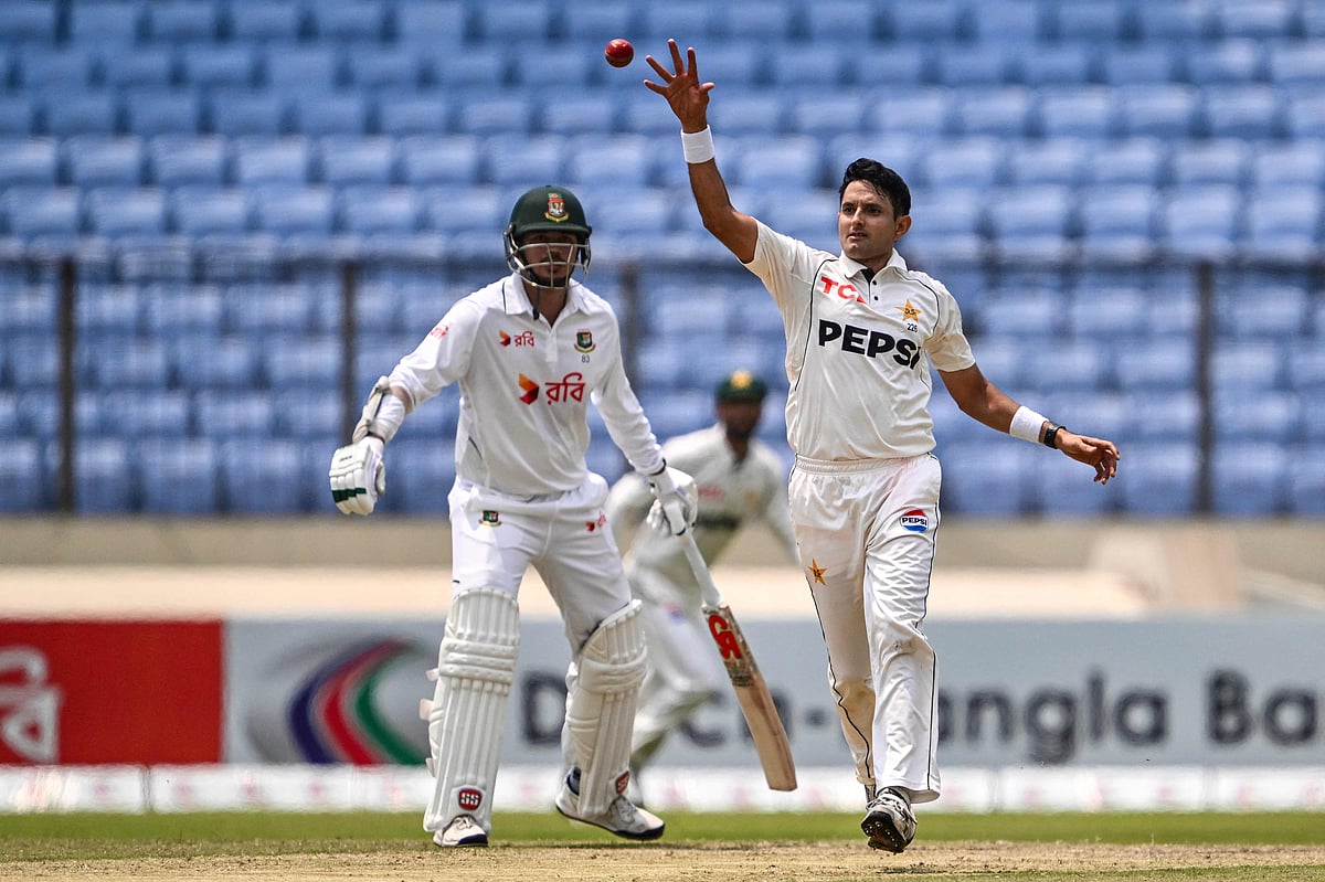Pakistan's Mohammad Abbas (R) fields the ball during the second day of the first test cricket match between Bangladesh and Pakistan at the Sher-e-Bangla National Stadium in Mirpur on May 9, 2026. (Photo by Munir UZ ZAMAN / AFP)
