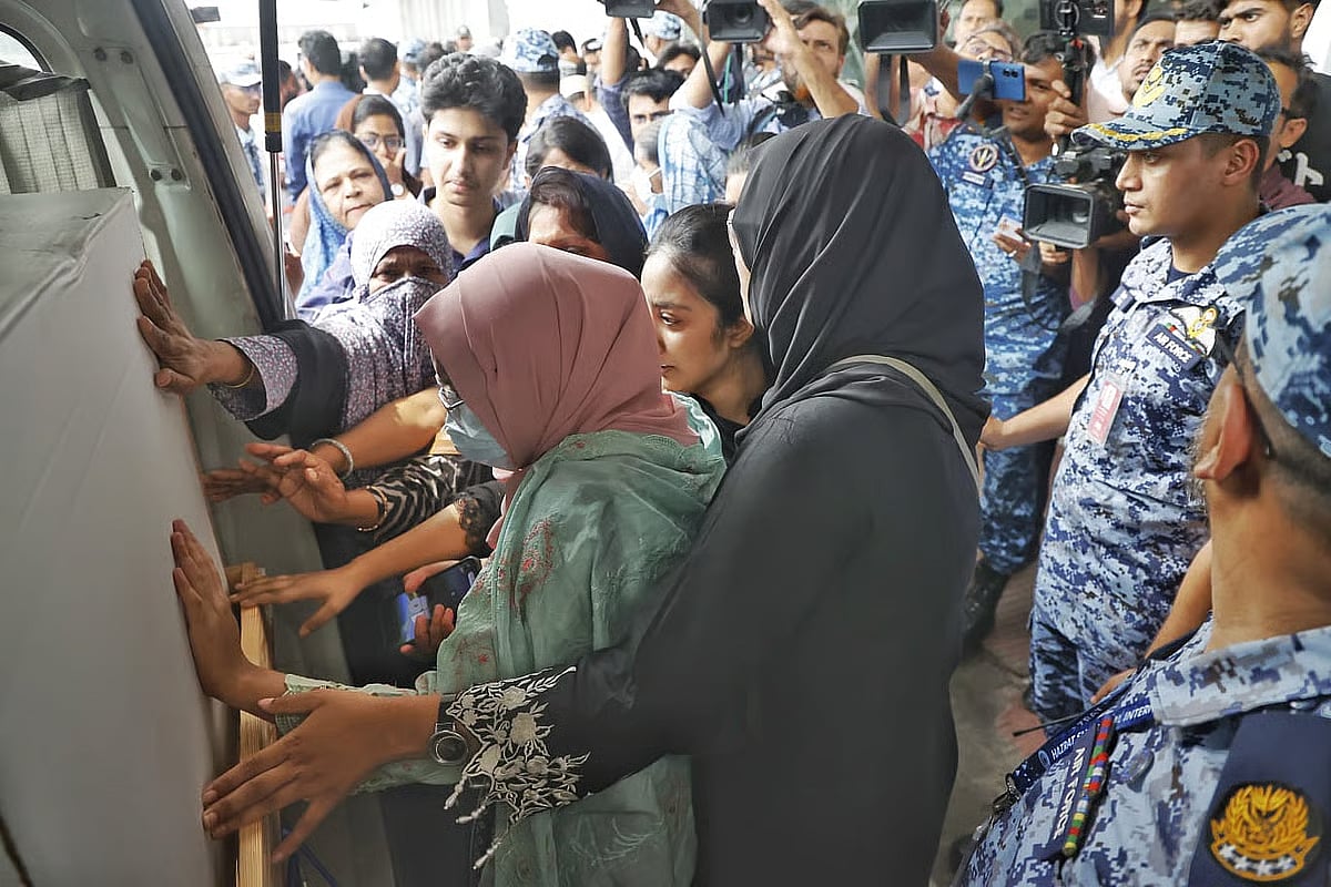 Relatives break down in tears while touching the coffin of Nahida Sultana Bristy, who was murdered in Florida. Photo taken at Hazrat Shahjalal International Airport in Dhaka on 9 May 2026.