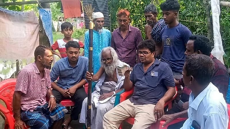 Syed Ahmed speaks to relatives at courtyard, Lakshmidia village, Hatia, Noakhali