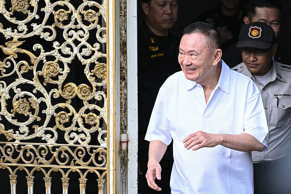 Thailand's former prime minister Thaksin Shinawatra looks on as he is greeted by his family members and relatives upon his release at Klong Prem Central Prison in Bangkok on 11 May, 2026. Thailand's former prime minister Thaksin Shinawatra was released early from prison on 11 May, raising the prospect of a return to the spotlight for the political heavyweight.