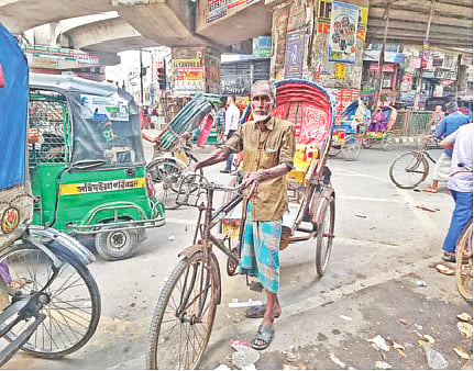 Photo shows rickshaw puller Md Ansar Ali in Malibagh, Dhaka on 14 May 2026.
