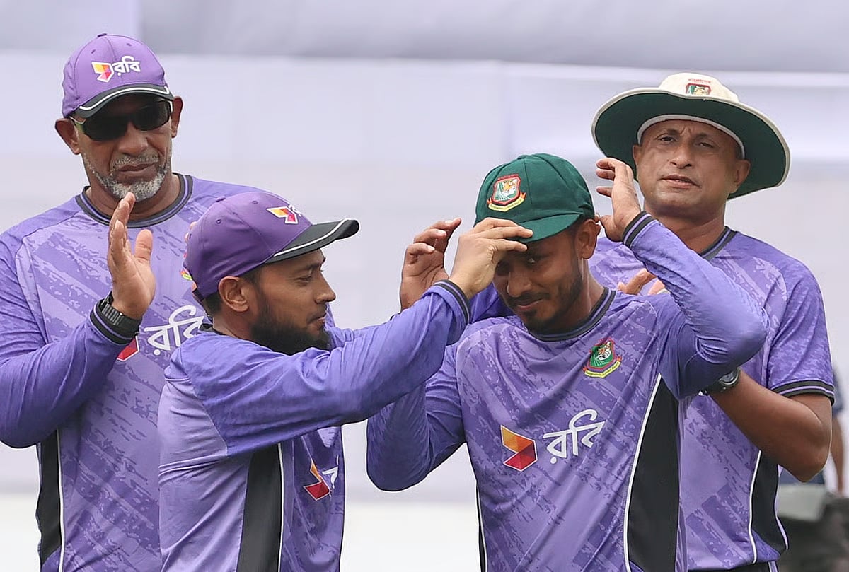 Tanzid Hasan Tamim receives his Test cap from Mushfiqur Rahim.