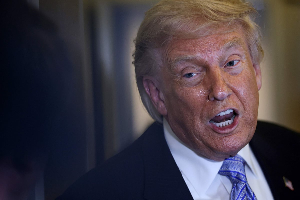 US President Donald Trump speaks to the media aboard Air Force One on 15 May, 2026 as he returns to the United States.