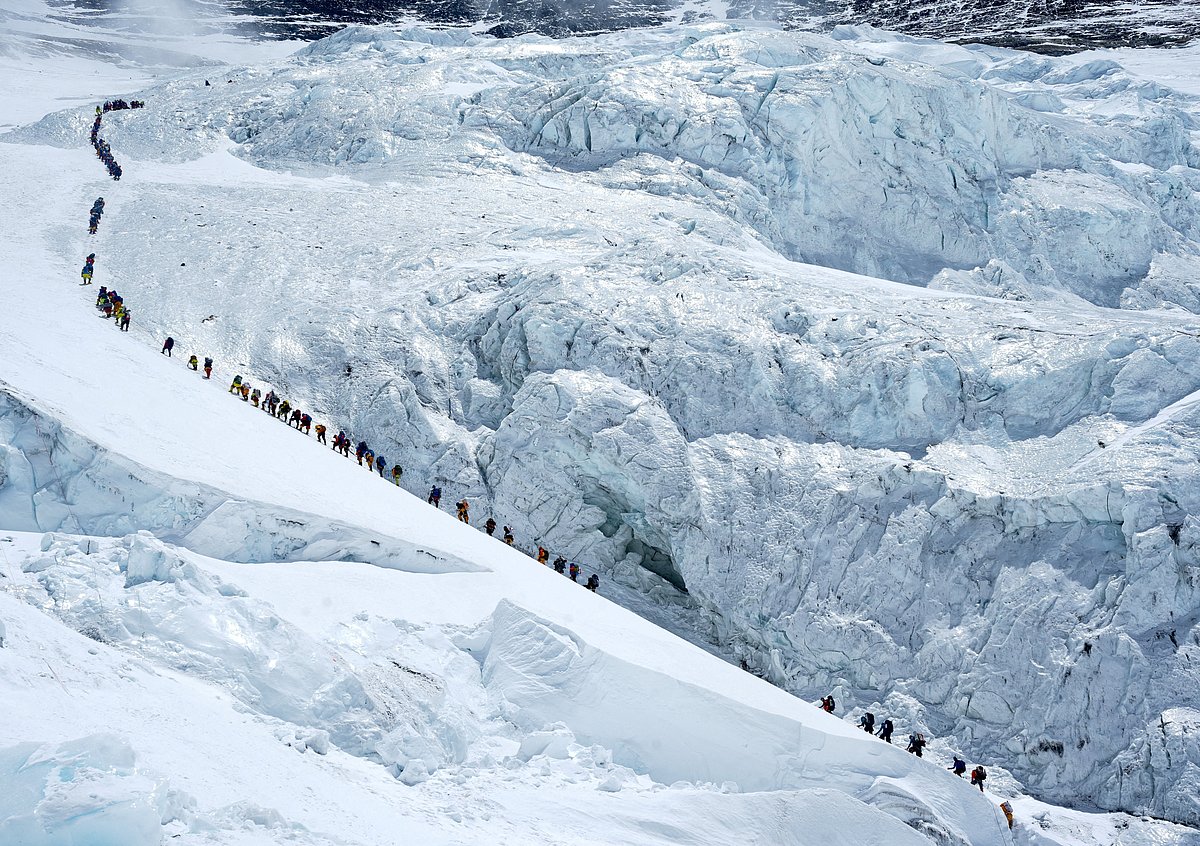 Climbers walk in a long queue as they head to summit Mount Everest in the Solukhumbu district, also known as the Everest region, Nepal, 18 May 2026.