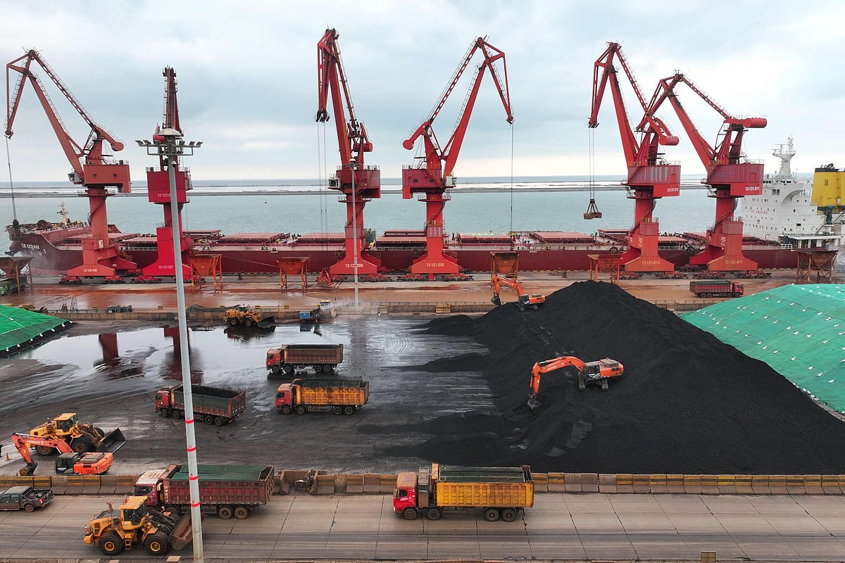 Imported coal is piled up after being unloaded from a ship at the coal terminal at the port in Lianyungang, in China's eastern Jiangsu province on 21 May, 2026.