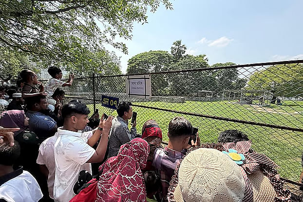 Visitors gather in front of the enclosure to see the buffalo named “Donald Trump.” Saturday, National Zoo in Mirpur, Dhaka