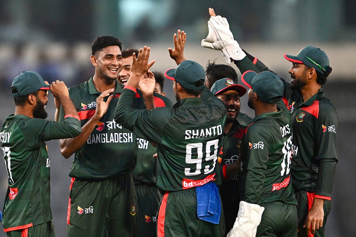 Nahid Rana (2L) celebrates with teammates after taking the wicket of Australia's Liam Scott during the first one-day international (ODI) cricket match between Bangladesh and Australia at the Sher-e-Bangla National Cricket Stadium in Dhaka on June 9, 2026