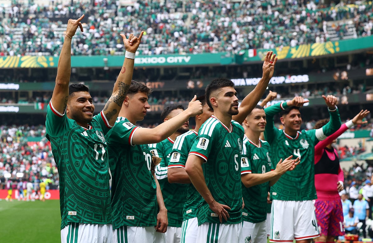 Mexico players celebrate with fans after the World Cup's opening match against South Africa