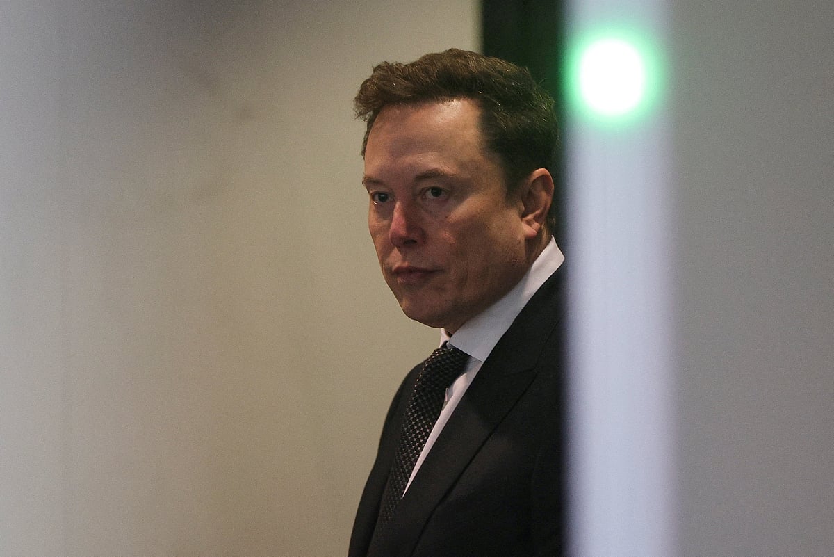 Elon Musk walks to attend the trial in his lawsuit over OpenAI for-profit conversion at a federal courthouse, in Oakland, California, U.S., April 29, 2026.