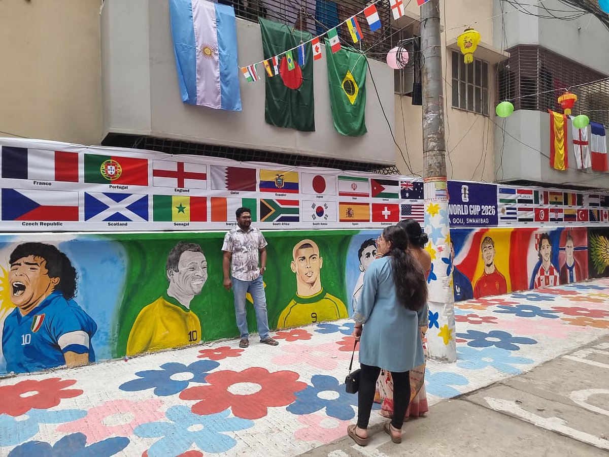 People come to see the portraits of star footballers painted on the walls in FIFA Goli in Tikatuli, Old Dhaka on 12 June 2026.