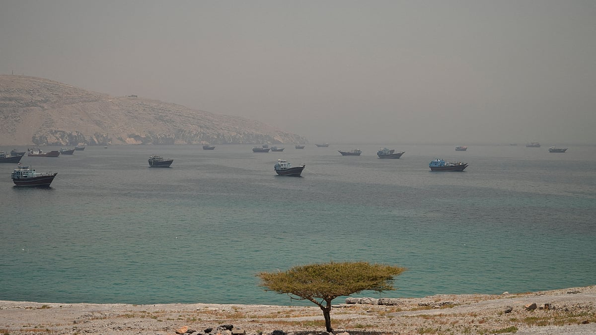 Vessels are anchored in the Strait of Hormuz, as seen from Musandam, Oman, June 11, 2026