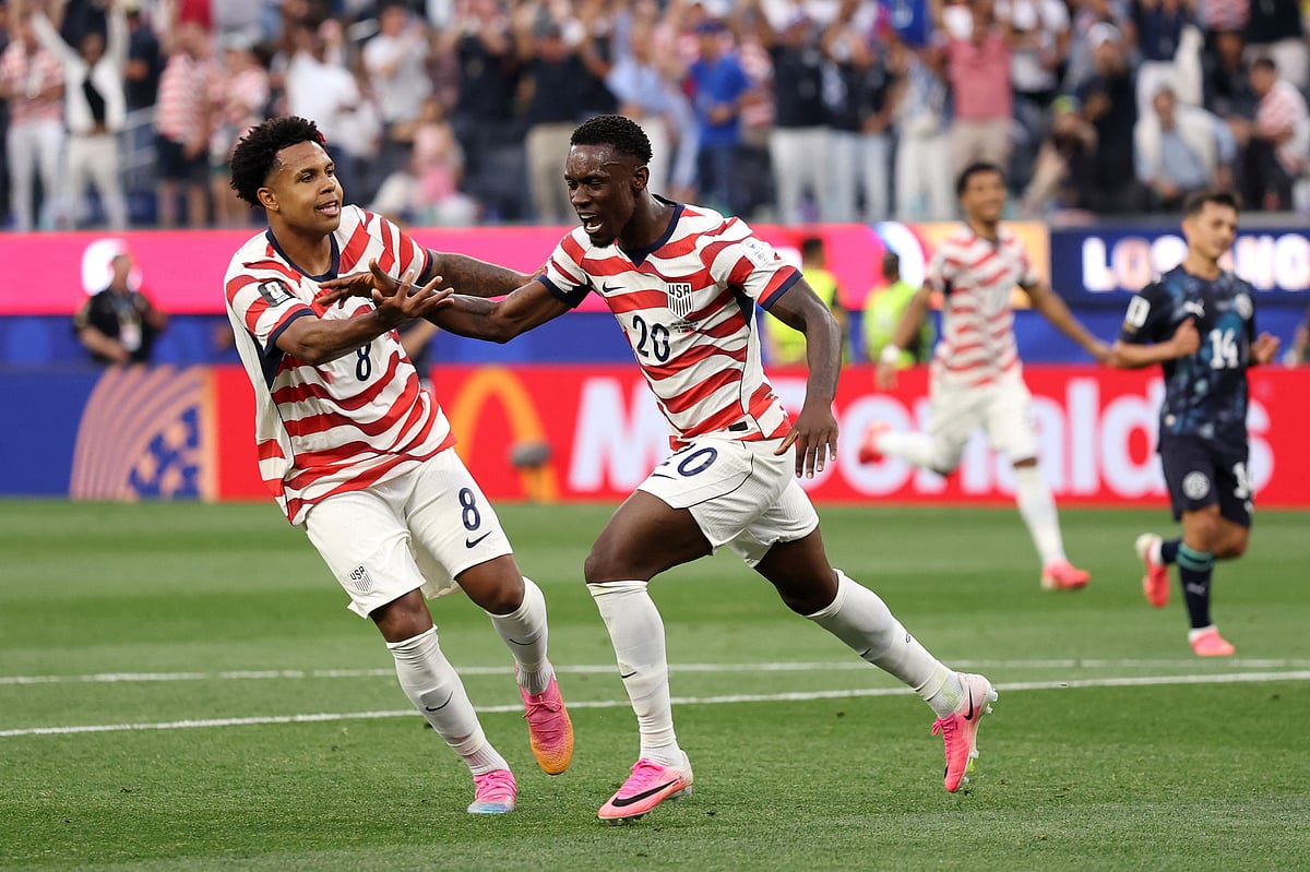  Folarin Balogun #20 of the United States celebrates scoring his team's second goal with Weston McKennie #8 during the FIFA World Cup 2026 Group D match between USA and Paraguay at Los Angeles Stadium on June 12, 2026 in Los Angeles, California.
