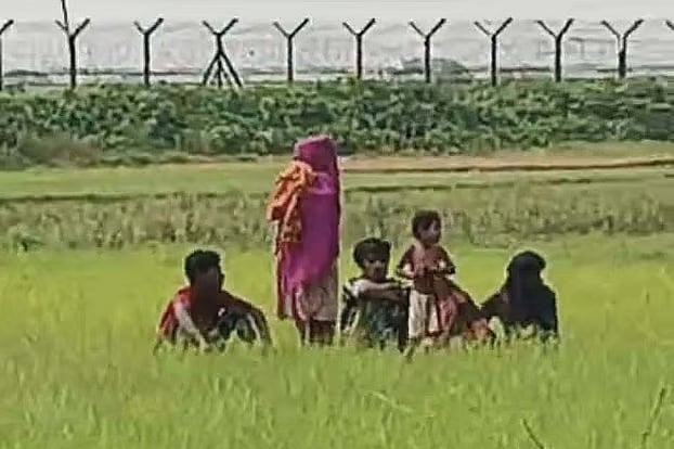 The six individuals are currently positioned about 50 yards inside Indian territory. The photograph was taken on Sunday morning.