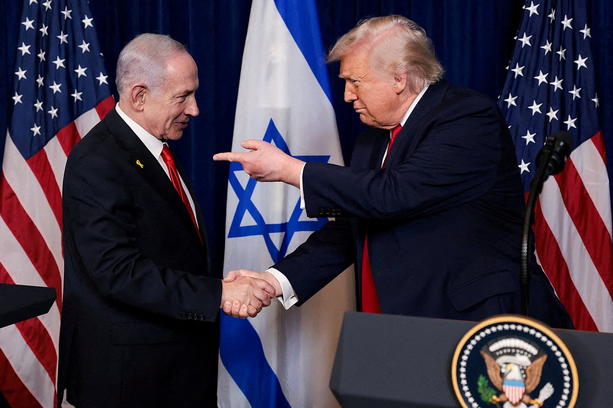 US President Donald Trump points his finger towards Israeli Prime Minister Benjamin Netanyahu as they shake hands during a press conference after meeting at Trump’s Mar-a-Lago club in Palm Beach, Florida, US, on 29 December 2025