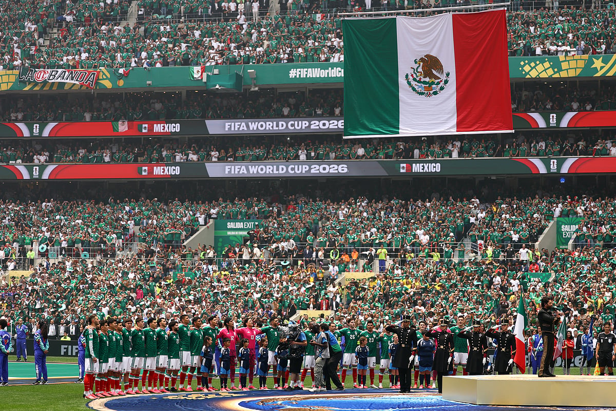 Mexico players line up during the national anthems as the Mexico national flag is raised