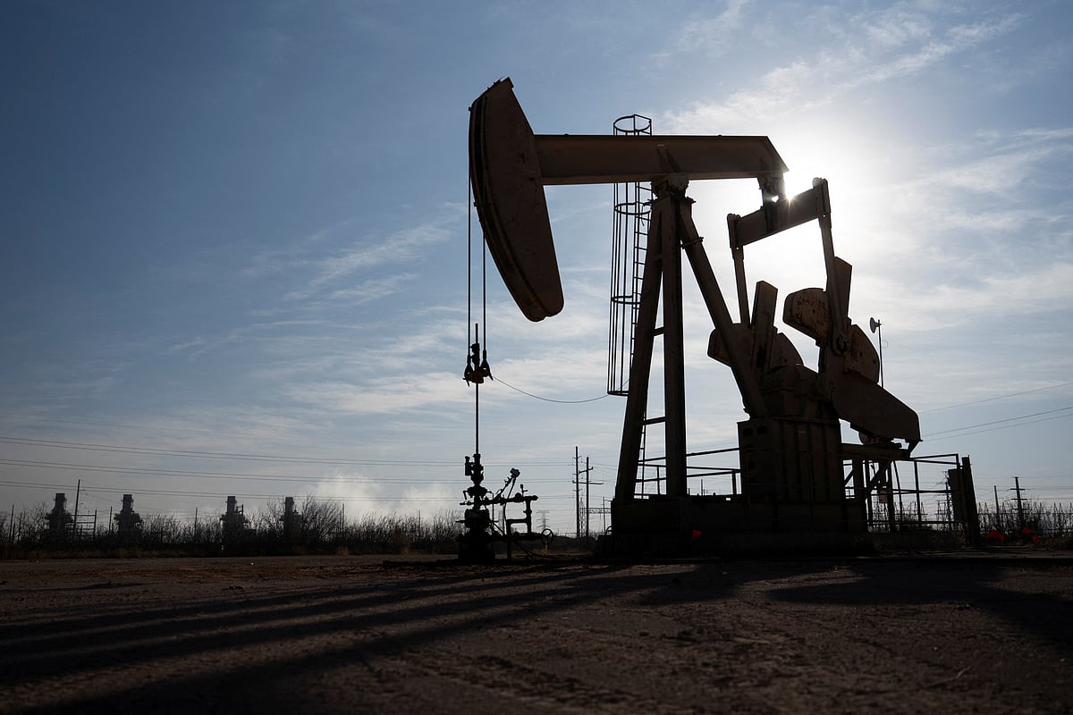 A pump jack operates near a gas turbine power plant in the Permian Basin oil field outside of Odessa, Texas, U.S. 18 February 2025. 