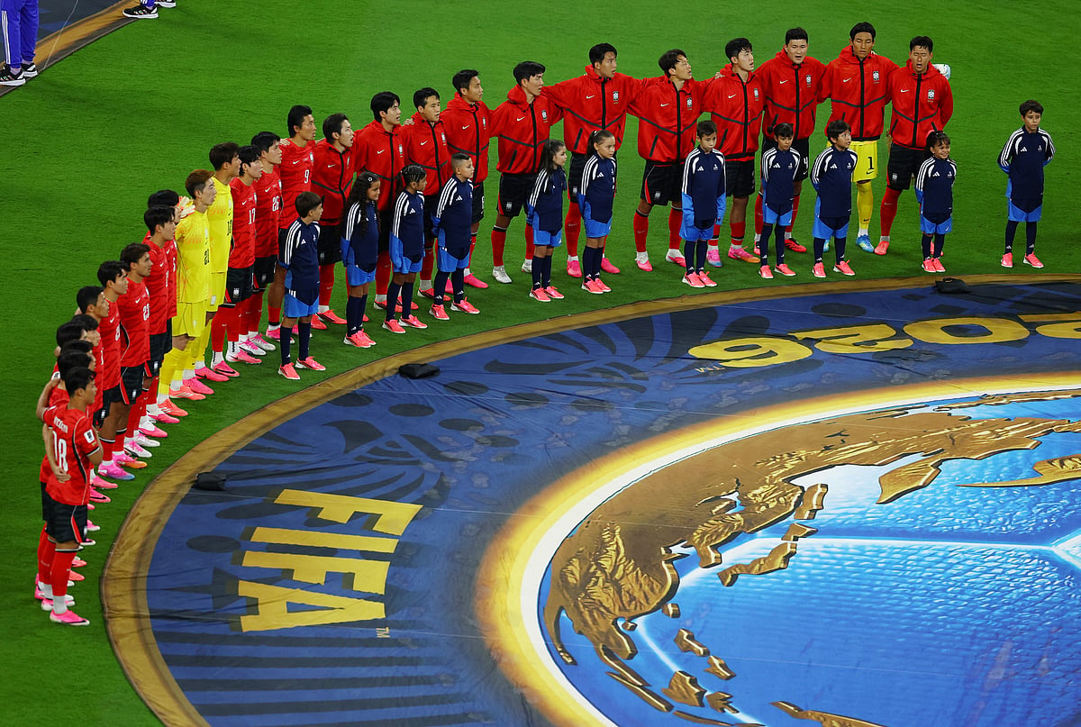 South Korea players line up during the national anthems