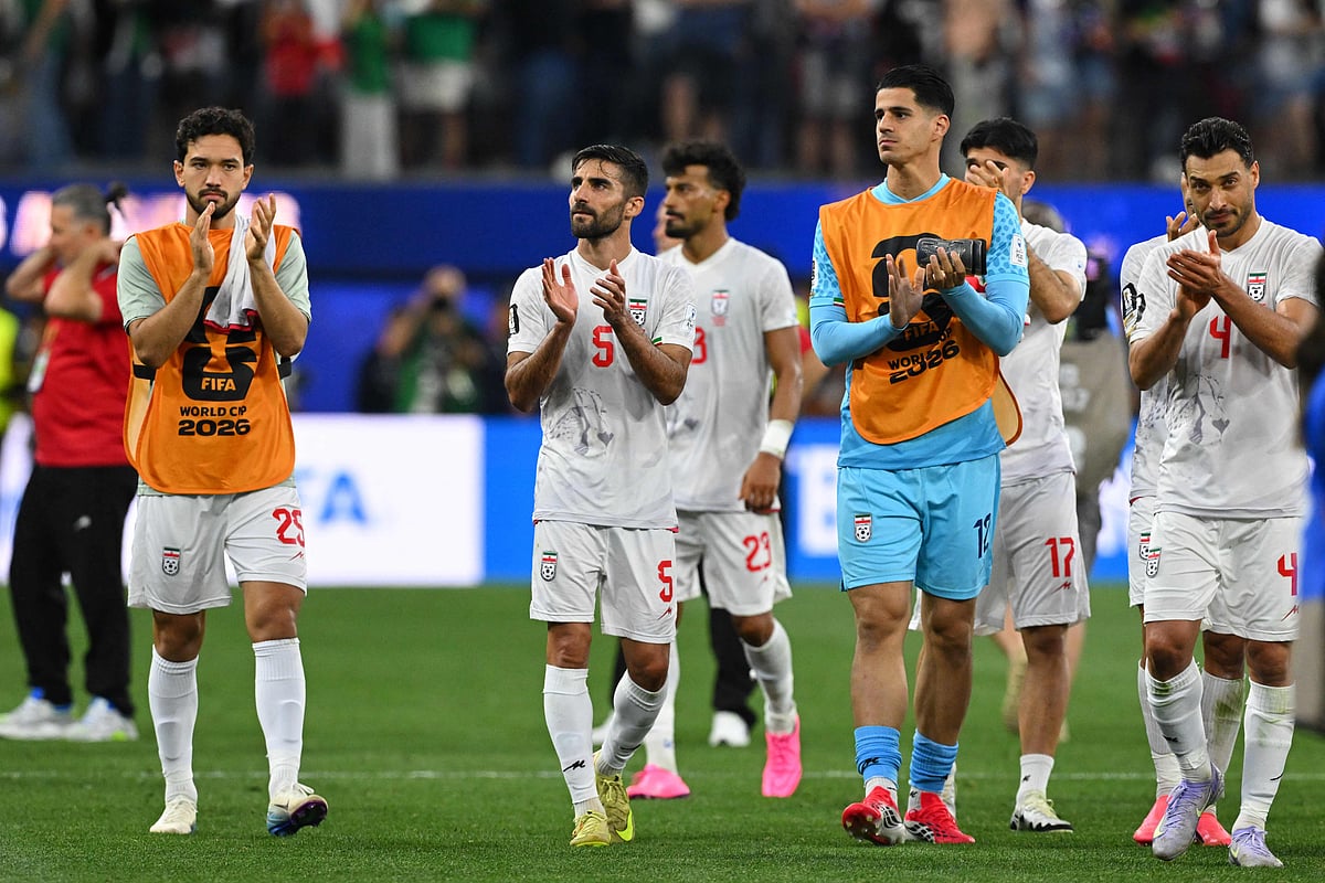 Iran's defender #05 Milad Mohammadi and teammates greet supporters after the 2026 World Cup Group G football match between Iran and New Zealand at Los Angeles Stadium in Inglewood on June 15, 2026. (Photo by Patrick T. Fallon / AFP)