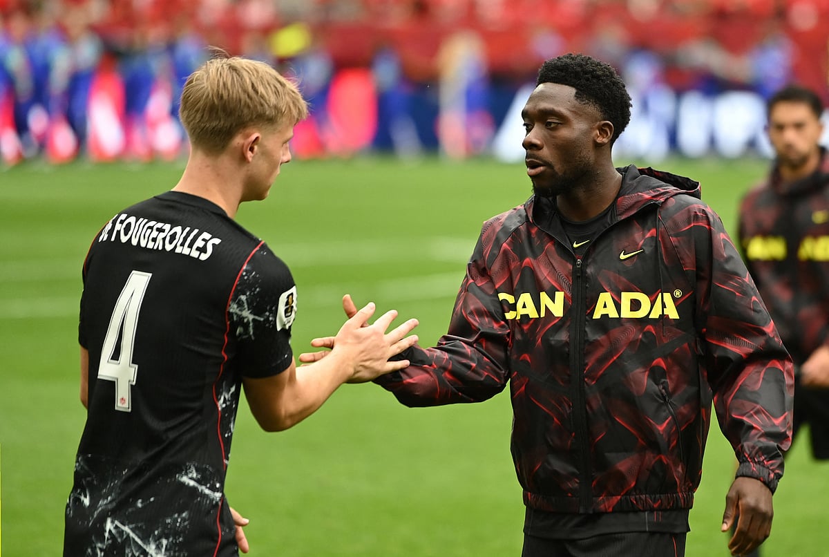 Football - FIFA World Cup 2026 - Group B - Canada v Qatar - BC Place, Vancouver, Canada - June 18, 2026
Canada's Luc de Fougerolles and Alphonso Davies before the match