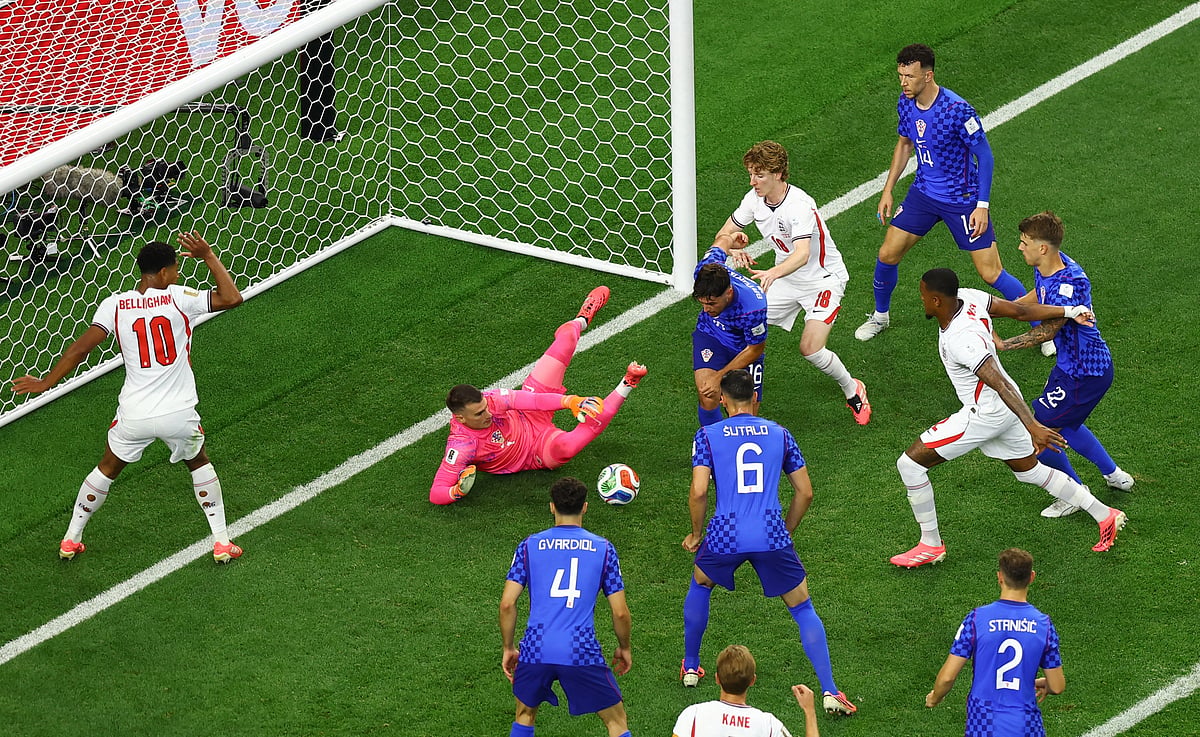 Croatia's Dominik Livakovic, Martin Baturina, Luka Vuskovic and Josip Sutalo in action with England's Ezri Konsa, Anthony Gordon and Jude Bellingham.