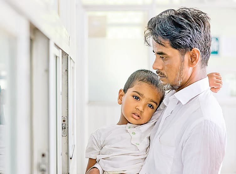 Three-year-old Rafi has developed symptoms of measles. His father brought him to the hospital. Photo taken at the DNCC Dedicated Covid-19 Hospital in Mohakhali, Dhaka on 20 June, 2026.