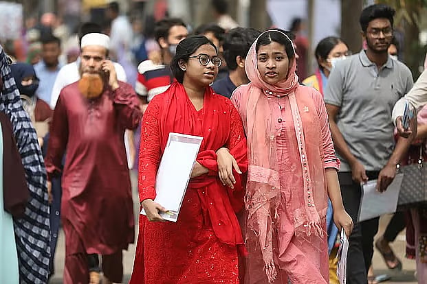Two students arrive to sit for an admission test.