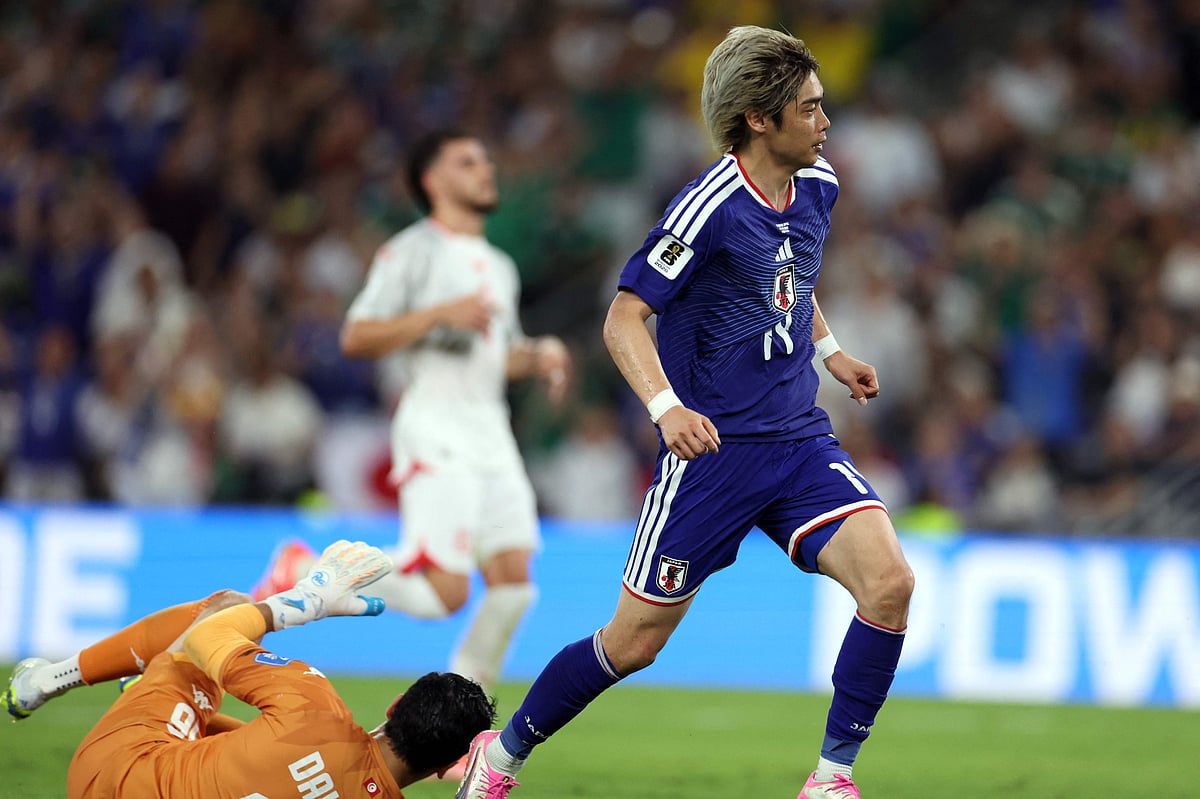 Japan's midfielder #14 Junya Ito watches the ball reaching the goal after beating Tunisia's goalkeeper #16 Aymen Dahmen to score his team third goal during the 2026 World Cup Group F football match between Tunisia and Japan at the Monterrey Stadium in Guadalupe, Mexico, on 20 June, 2026.