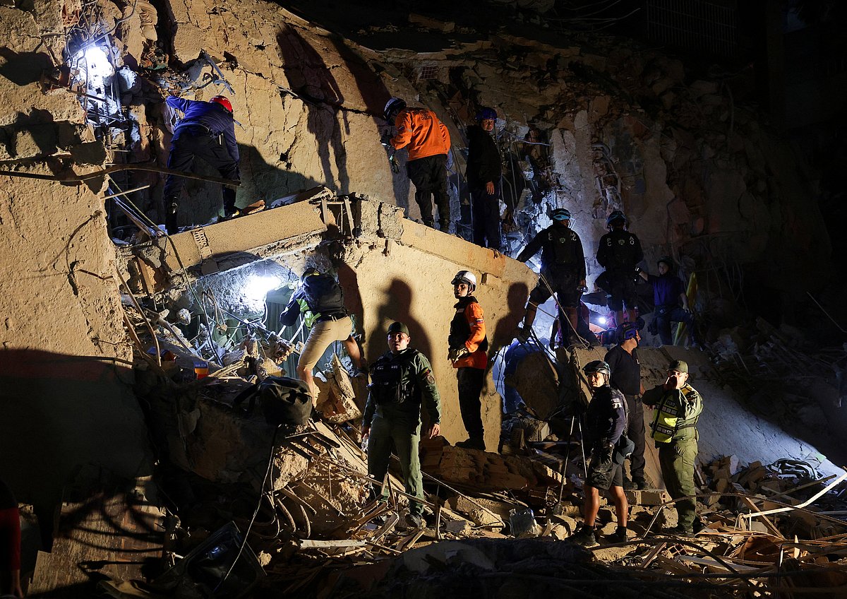 Emergency services work at the site of a collapsed building after earthquakes hit the country, in Caracas, Venezuela, 24 June, 2026.