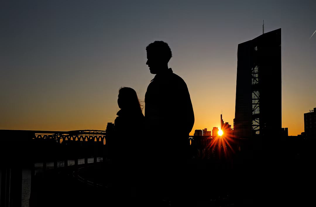 The sun sets behind the skyline and the headquarter of the European Central Bank (ECB) in Frankfurt, Germany, 6 April, 2025.