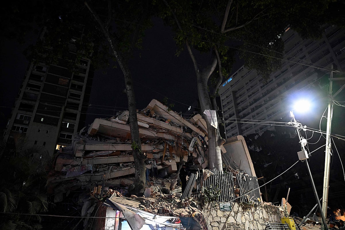 A collapsed building is seen following an earthquake in Caracas on 24 June 2026. Two earthquakes of magnitude 7.2 and 7.5 struck the same area of Venezuela on the evening of June 24, causing buildings to collapse, according to the United States Geological Survey (USGS) and AFP journalists. The quakes drove residents of the capital, Caracas, into the streets