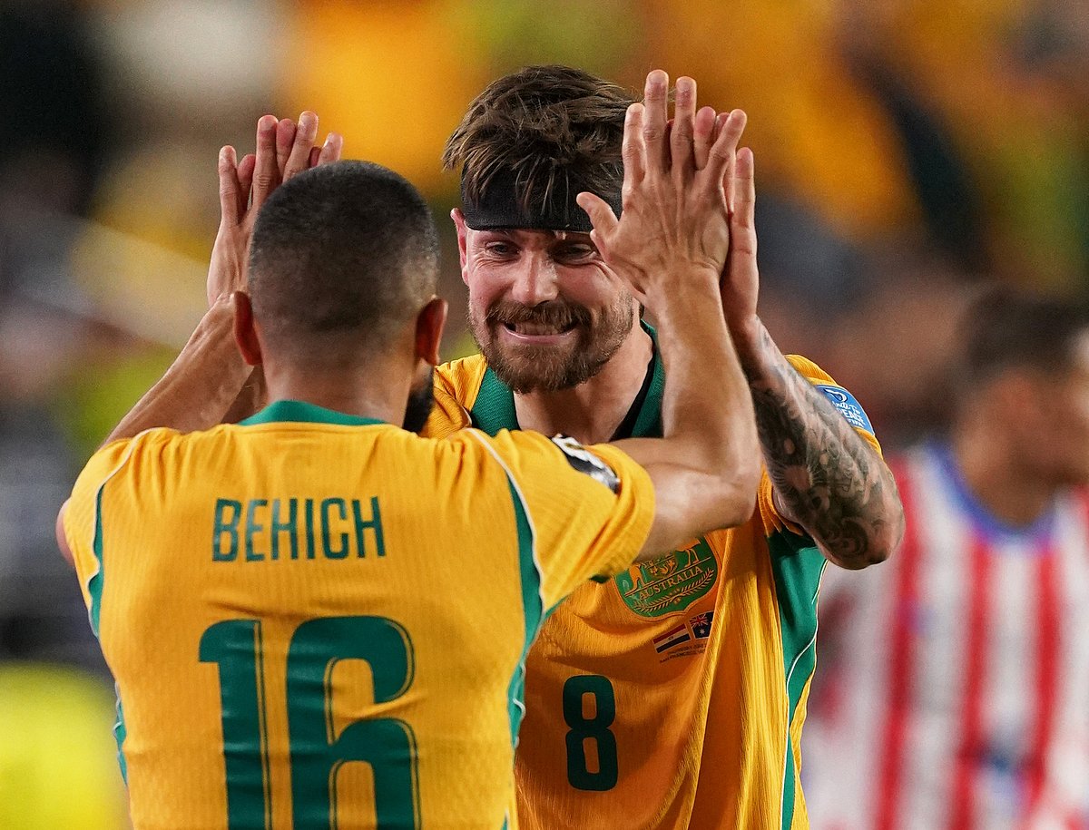 Australia's Connor Metcalfe and Aziz Behich celebrate after the match at San Francisco Bay Area Stadium, Santa Clara, California, US - 25 June, 2026.