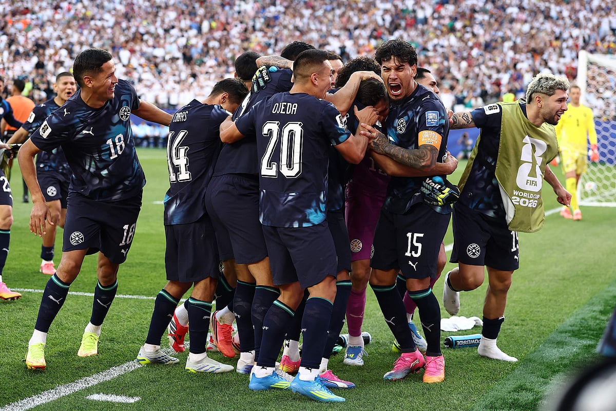 Paraguay's goalkeeper #12 Orlando Gill celebrates with teammates after winning the penalty shootout of the 2026 World Cup round of 32 football match between Germany and Paraguay at the Boston Stadium in Foxborough on June 29, 2026.