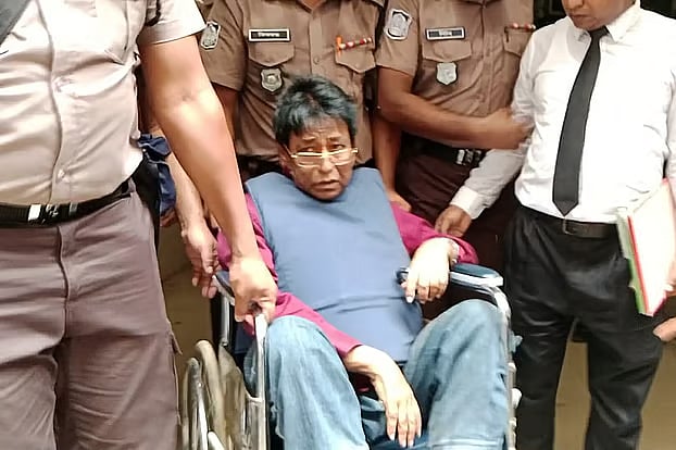 Journalist Azhar Ali Sarkar is brought to court in a wheelchair. The photo was taken on Monday at the Dhaka Metropolitan Magistrate’s Court.
