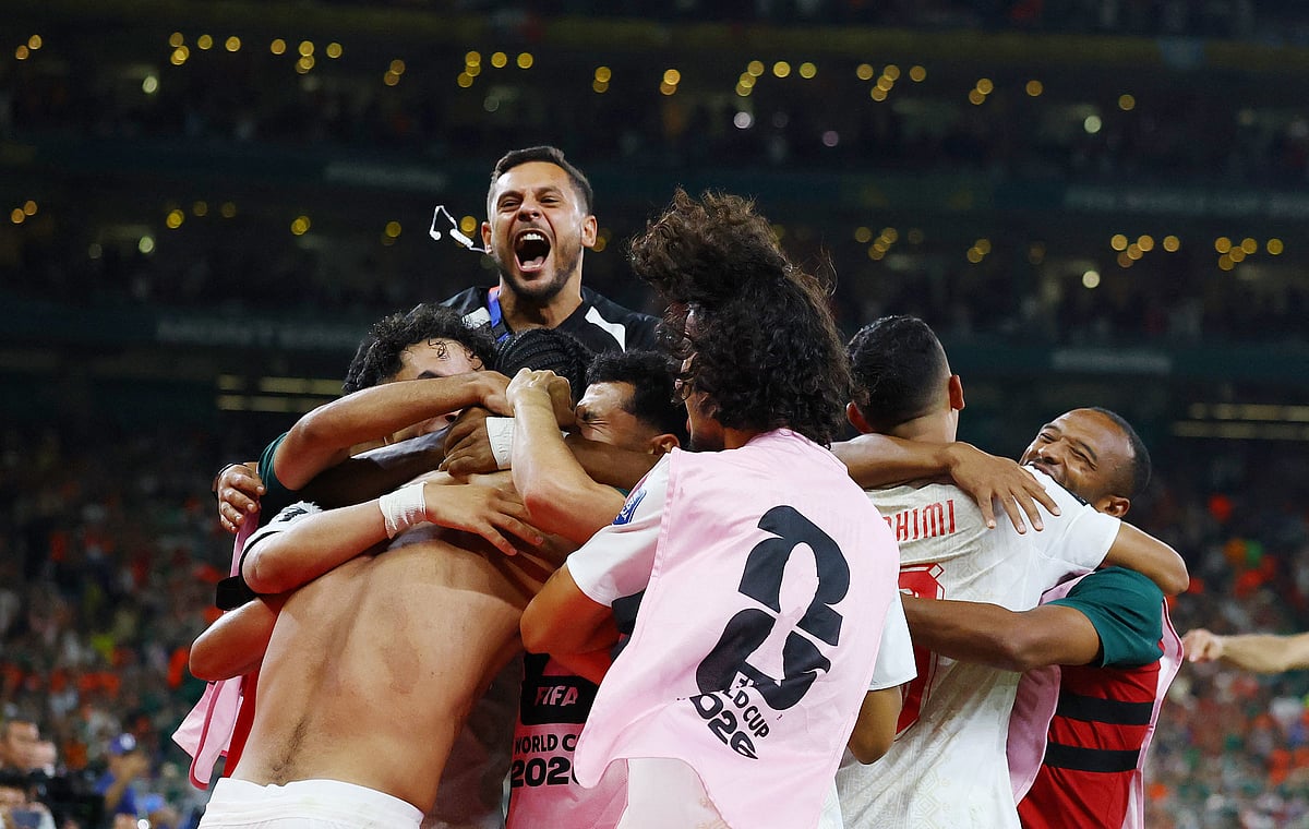 Morocco's Ayoub El Kaabi and teammates celebrate after the penalty shootout as Morocco qualify for the round of 16 stage of the World Cup