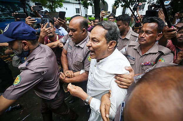 After the verdict, Hasanul Haq Inu being escorted from the International Crimes Tribunal. Today, Tuesday.