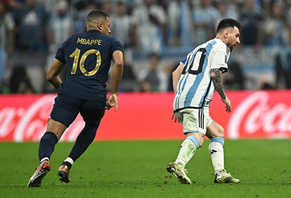 France’s Kylian Mbappe and Argentina’s Lionel Messi at the Qatar 2022 World Cup final football match between Argentina and France at Lusail Stadium in Lusail, north of Doha, Qatar on 18 December 2022.