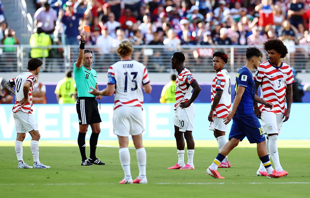 Football - FIFA World Cup 2026 - Round of 32 - United States v Bosnia and Herzegovina - San Francisco Bay Area Stadium, Santa Clara, California, U.S. - July 1, 2026
Folarin Balogun of the U.S. is shown a red card by referee Raphael Claus