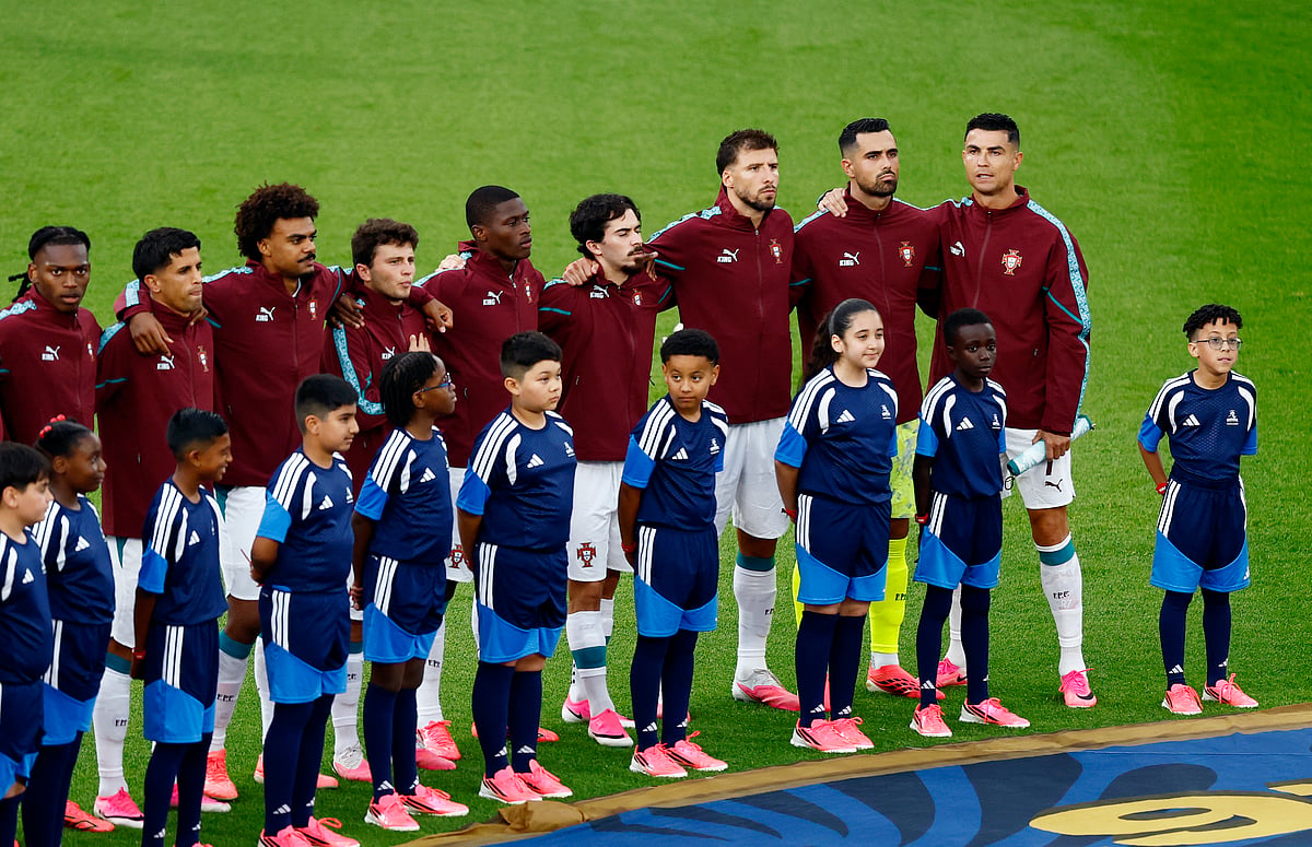 Portugal's Cristiano Ronaldo and teammates line up with young mascots during the national anthems before the match against Croatia at Toronto Stadium, Toronto, Canada - July 2, 2026