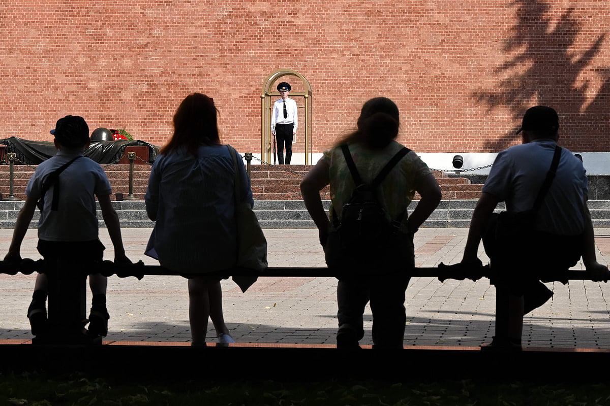 People shelter from the heat in the shade of trees in Alexandrovsky Garden in central Moscow on 1 July, 2026.