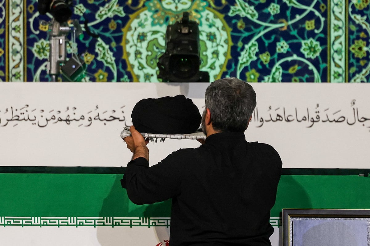 A man places a turban over the coffin of Iran’s late Supreme Leader Ayatollah Ali Khamenei, who was killed on 28 February during Israeli and US airstrikes on Iran, during a farewell ceremony for him at the Imam Khomeini Grand Mosalla in Tehran, Iran, on 3 July 2026