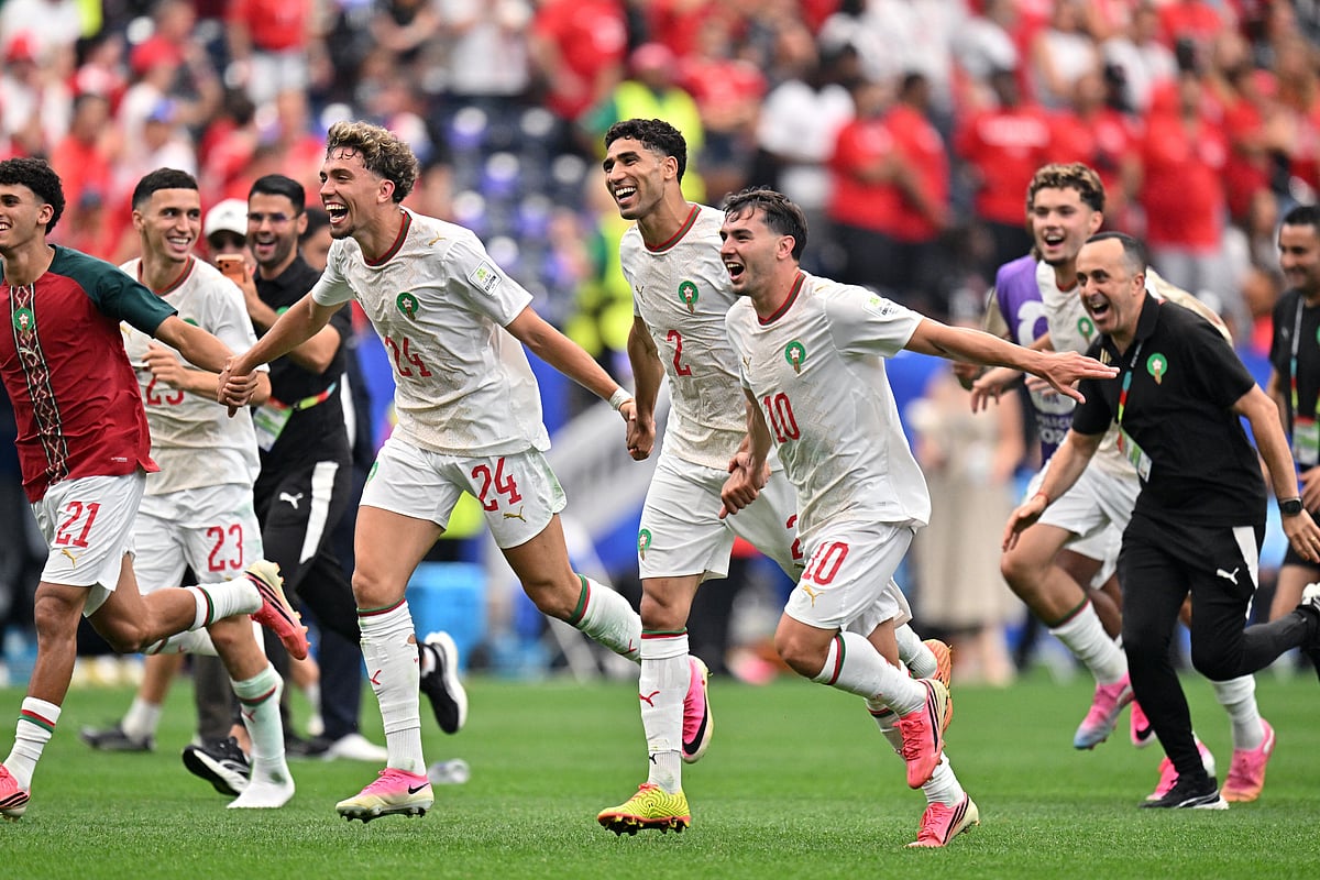 Football - FIFA World Cup 2026 - Round of 16 - Canada v Morocco - Houston Stadium, Houston, Texas, U.S. - July 4, 2026
Morocco's Neil El Aynaoui, Morocco's Achraf Hakimi and Morocco's Brahim Diaz celebrate after the match as Morocco qualify for the quarter final stage of the World Cup