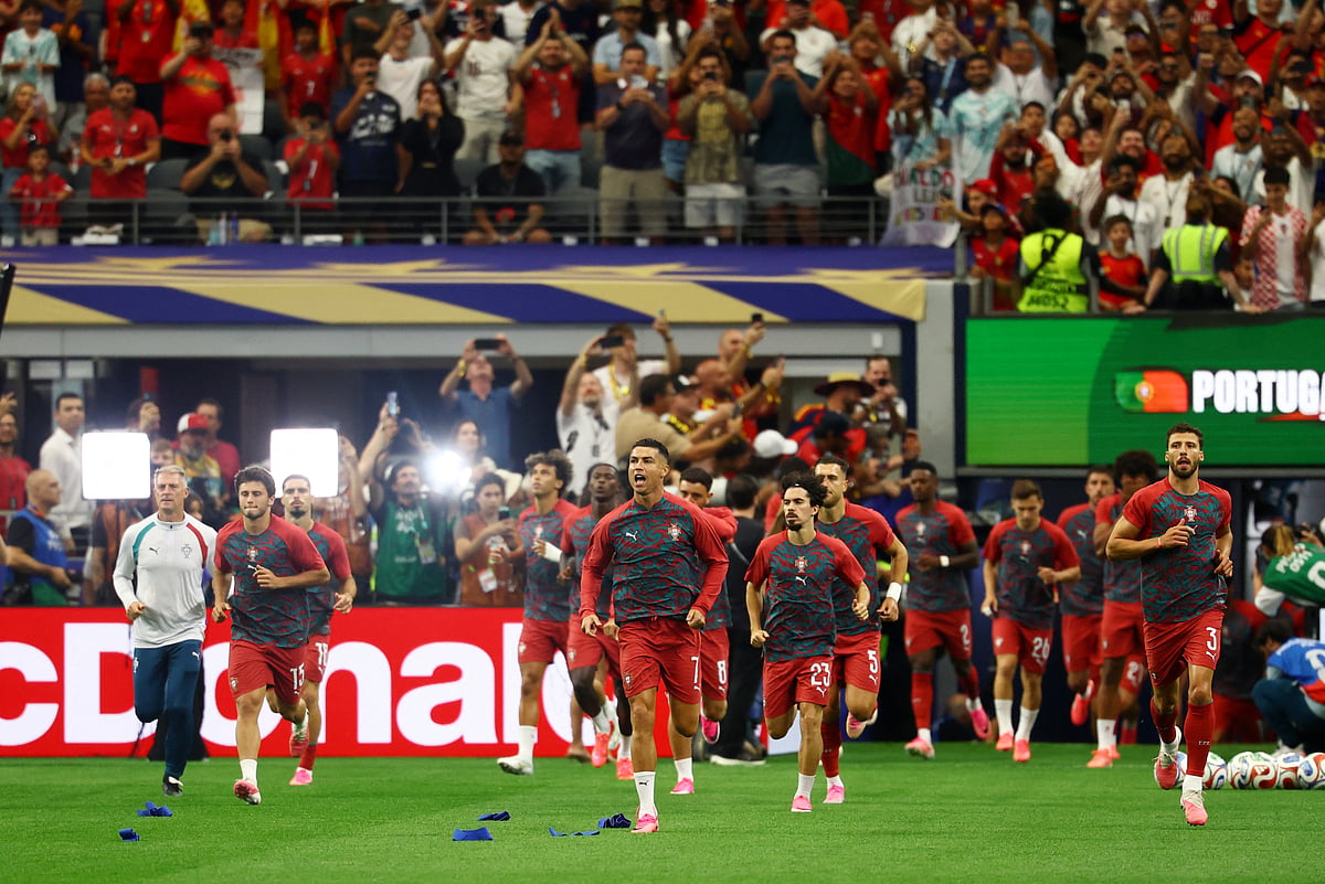 Football - FIFA World Cup 2026 - Round of 16 - Portugal v Spain - Dallas Stadium, Arlington, Texas, U.S. - July 6, 2026
Portugal's Cristiano Ronaldo, Vitinha, Ruben Dias and Joao Neves during the warm up before the match