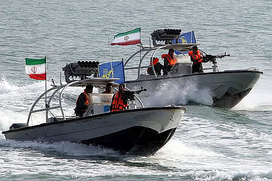 Iranian naval vessels patrol the Strait of Hormuz.