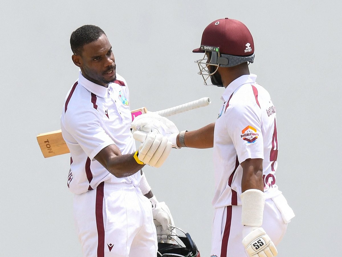 Justin Greaves (L) and Shai Hope (R) of West Indies congratulate each other on a 100 not out during the 4th day of the 2nd Test between Sri Lanka and West Indies at Vivian Richards Cricket Stadium in North Sound, Antigua and Barbuda, on 6 July 2026